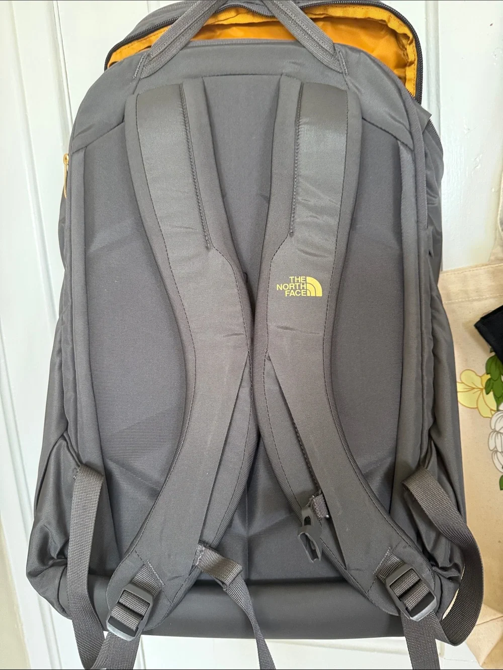 The North Face Black Backpack with Gold Logo Accent Kaban